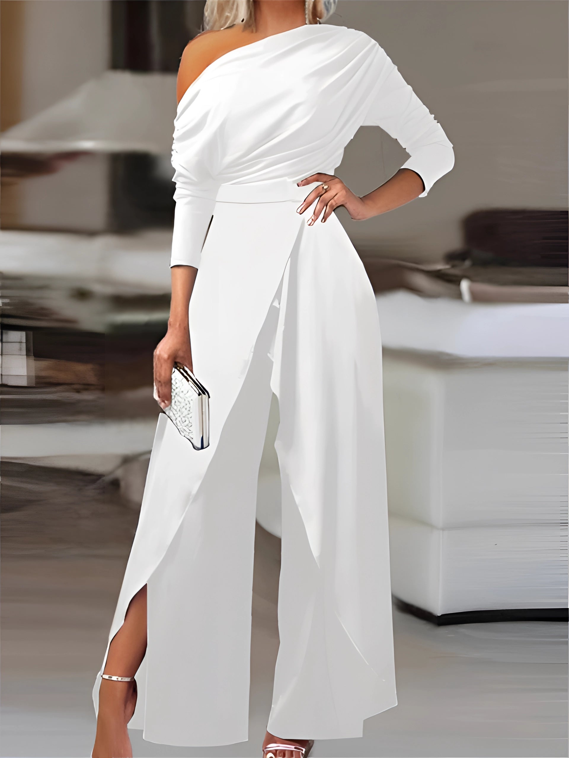 Elegant white one-shoulder asymmetric wide-leg evening jumpsuit on a mannequin, showcasing its unique neckline, sleeve, and tailored waist, size 2XL.