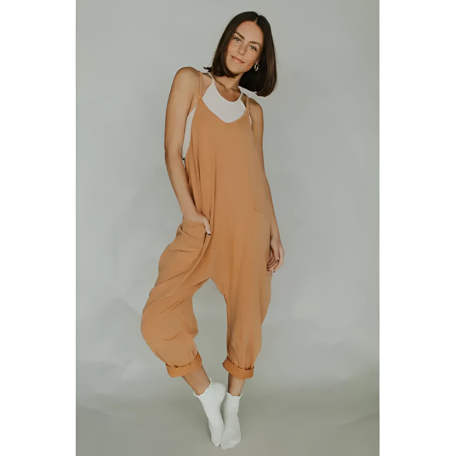 Women's camel sleeveless loose-fit jumpsuit featuring lightweight fabric, wide legs, and a relaxed fit, perfect for summer wear.