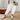 Women's white linen jogger pants in size 2XL, showcasing soft and lightweight fabric, eco-friendly material, worn by a model standing on a wooden floor.